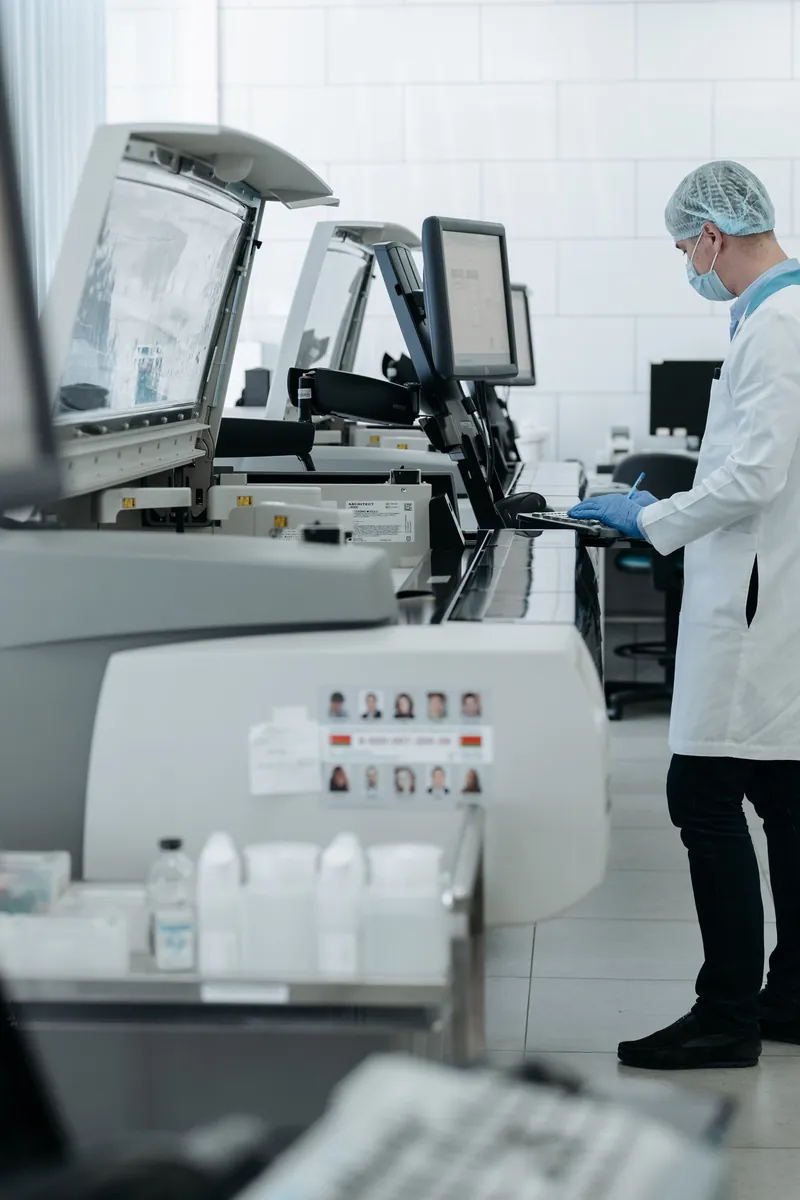 Laboratory instruments with a technician in a white coat