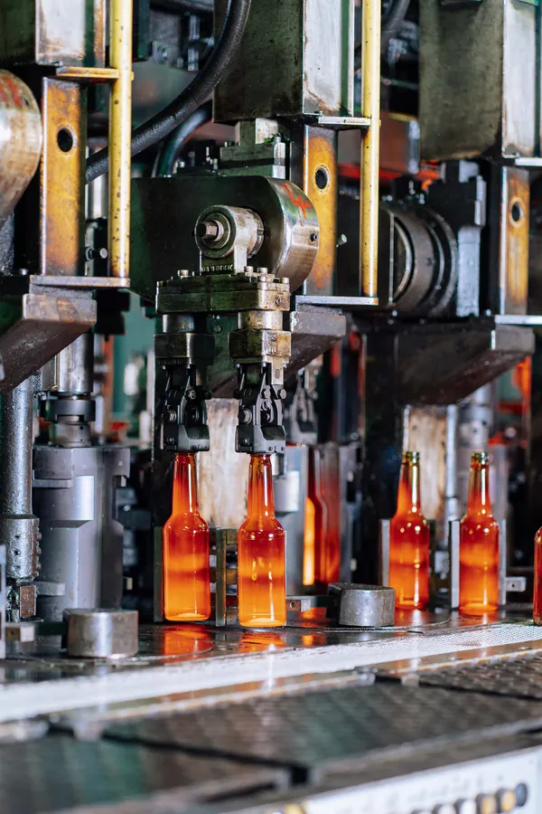 Amber bottles moving along a production line